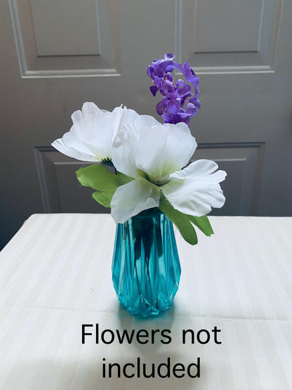 Set of three small hand-crafted teal resin vases.