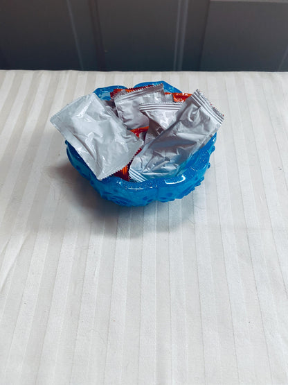 Small handmade decorative resin bowl in teal