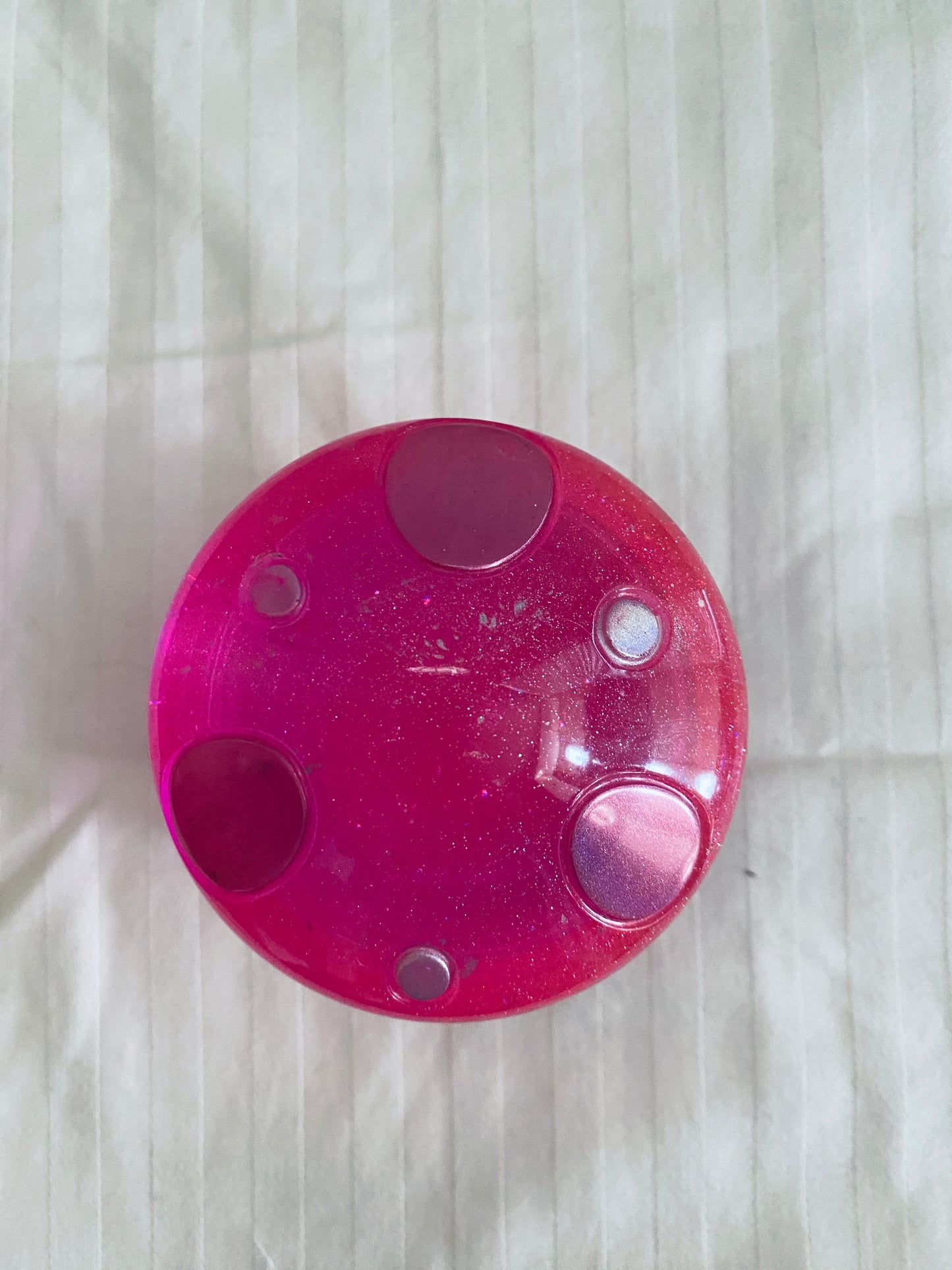 Pink mushroom-shaped pot with lid.