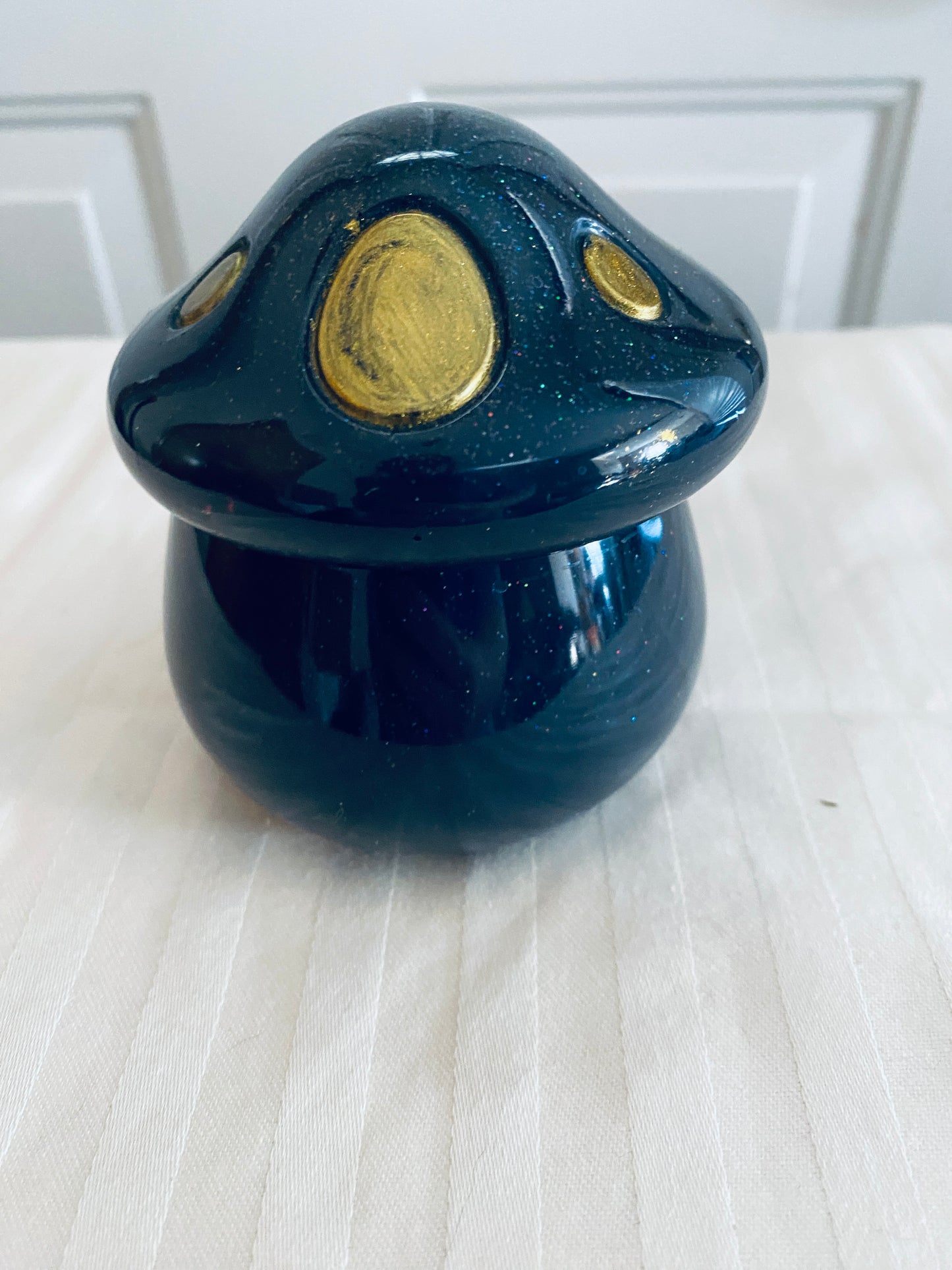 Black and Gold mushroom-shaped pot with lid.