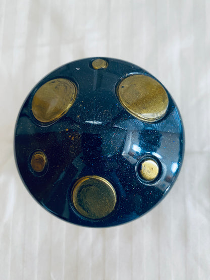 Black and Gold mushroom-shaped pot with lid.