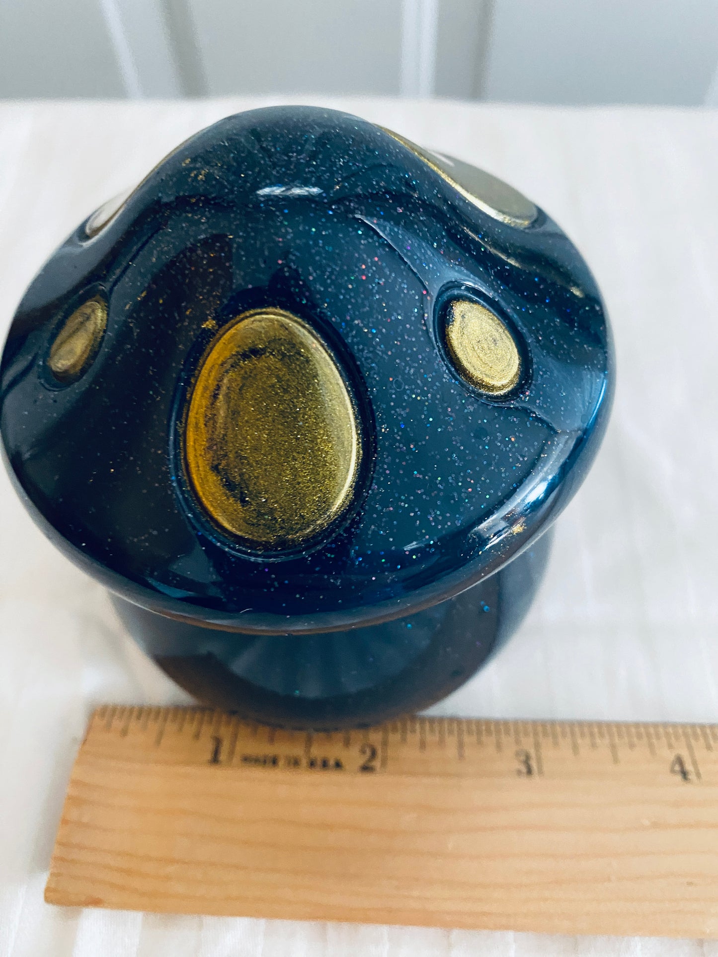 Black and Gold mushroom-shaped pot with lid.