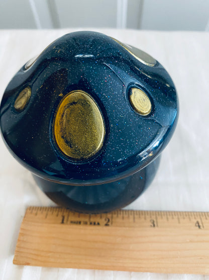 Black and Gold mushroom-shaped pot with lid.