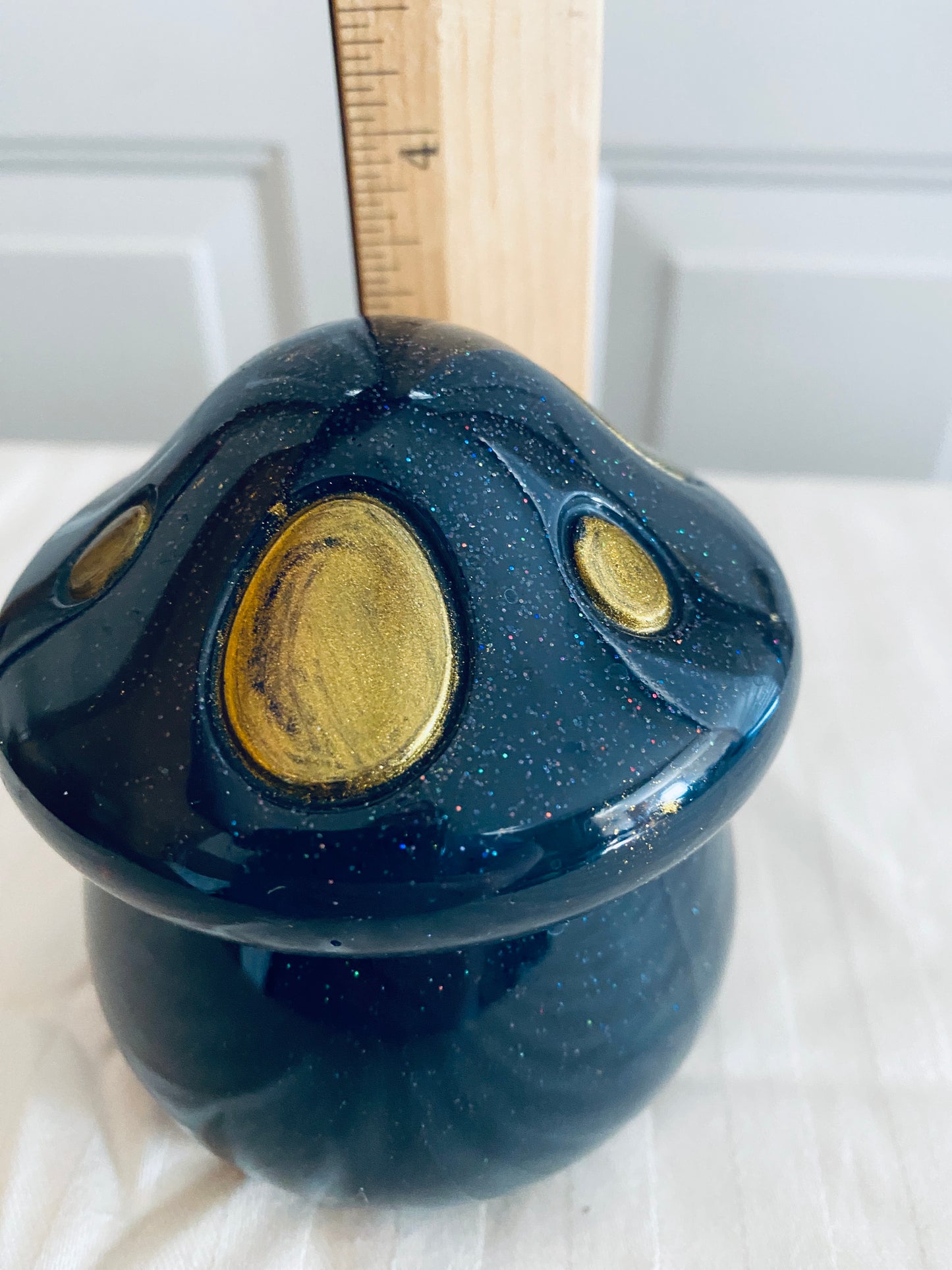 Black and Gold mushroom-shaped pot with lid.