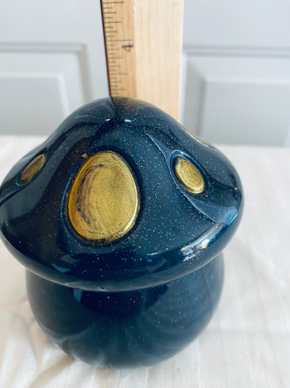 Black and Gold mushroom-shaped pot with lid.
