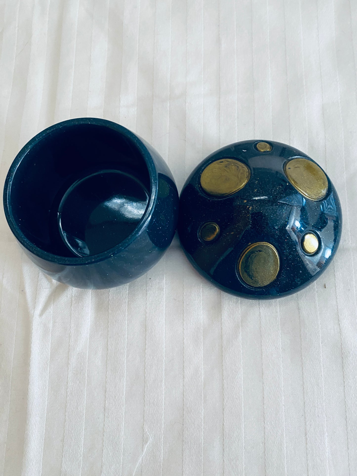 Black and Gold mushroom-shaped pot with lid.