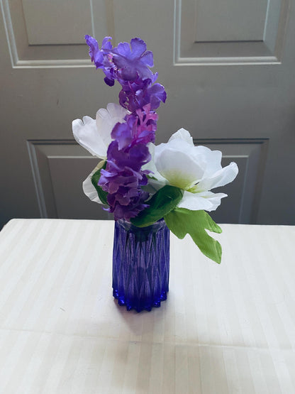 Set of two small hand-crafted purple resin vases.
