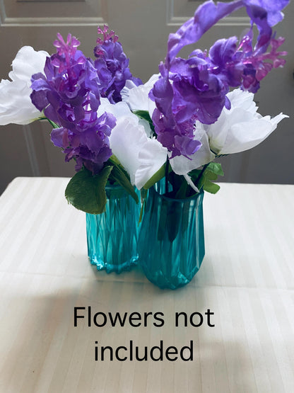 Set of three small hand-crafted teal resin vases.