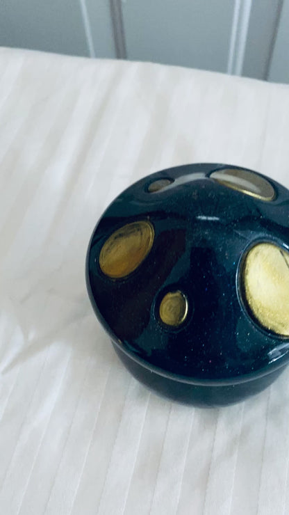 Black and Gold mushroom-shaped pot with lid.